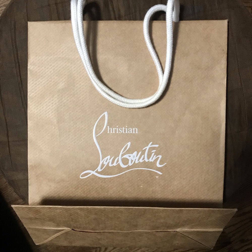 Small original authentic CHRISTIAN LOUBOUTIN shopping bag. Approximately 12 X 10